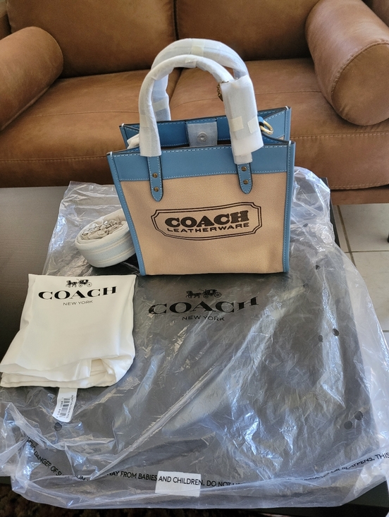 Coach Handbags - Brand New Coach Canvas Tote in Beige and Blue with Leather Trim.